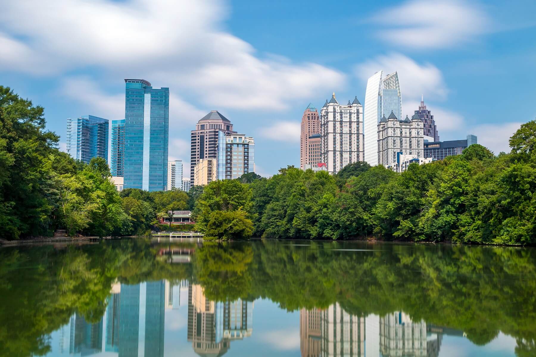 The view of Lake Clara Meer and the city skyline from Piedmont Park in Atlanta