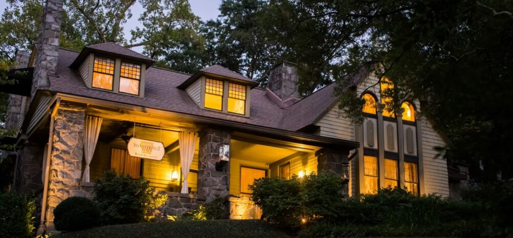 Stonehurst Place lit up at night exterior of the house