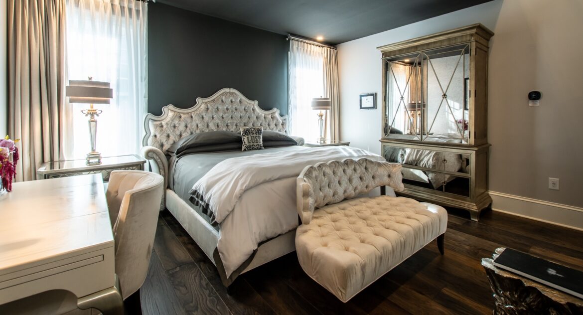 Fowler room with velvet sofa and bed and mirrored wardrobe