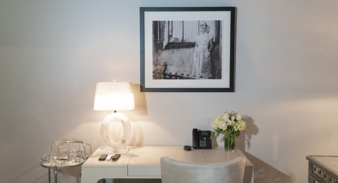Stedman Suite desk with black and white picture of a woman on wall above in Stonehurst Place