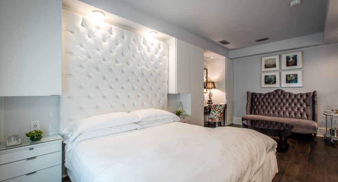 large white bed in lovely decorated bedroom with wood floors - Stedman Suite at Stonehurst Place