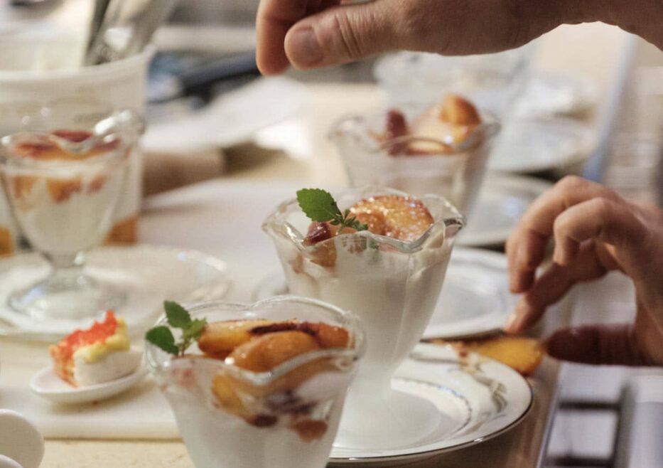 Yogurt and fruit cups being prepared in kitchen in Stonehurst Place