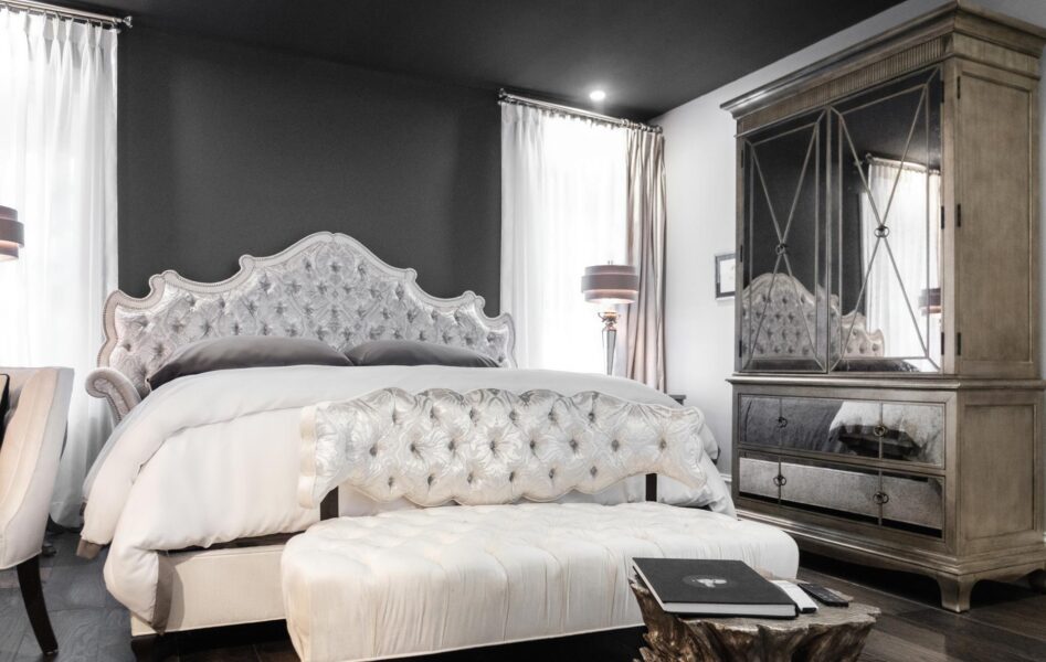 Stonehurst Place - The Fowler Suite-41 Fowler Suite sitting area with white sofa and silver velvet flowers with a tree stump as the coffee table