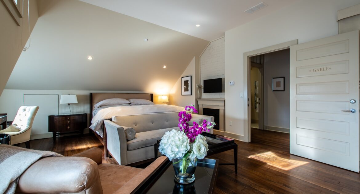 Gables room with a leather chair and lounge sofa sitting area