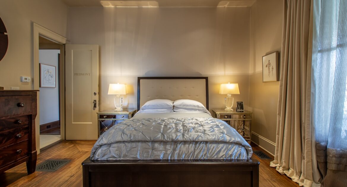 The Piedmont room with queen-sized bed and two mirrored nightstands