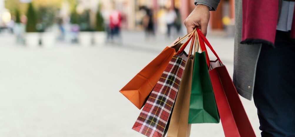 Someone holding shopping bags in Decatur Square near Atlanta