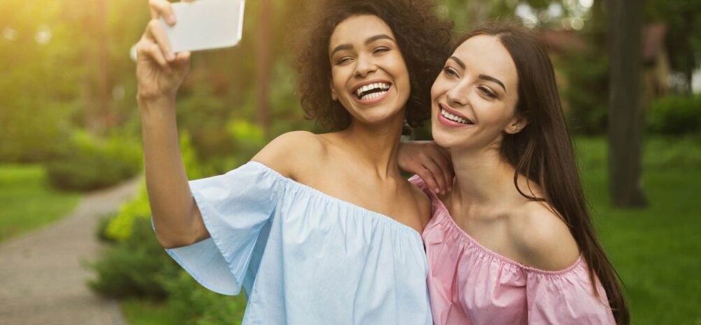 Two women taking a picture at Piedmont Park, one of the most Instagrammable places in Atlanta Two women taking a picture at Piedmont Park, one of the most Instagrammable places in Atlanta