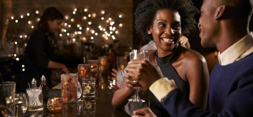 Two people at a bar enjoying the Midtown Atlanta nightlife