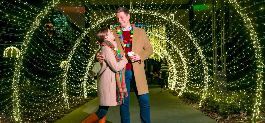 A couple at the Atlanta Botanical Garden enjoying one of the best things to do in Atlanta in December