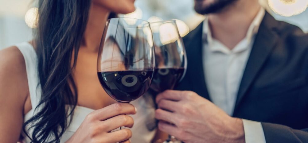 A man and woman holding wine glasses at the Uncorked Atlanta Wine Festival A man and woman holding wine glasses at the Uncorked Atlanta Wine Festival
